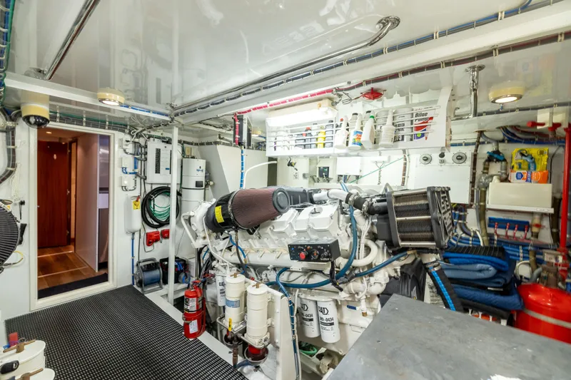 Outrageous Yacht Photos Pics Engine room of 2005 Hatteras 80 Motor Yacht, featuring organized equipment and machinery.