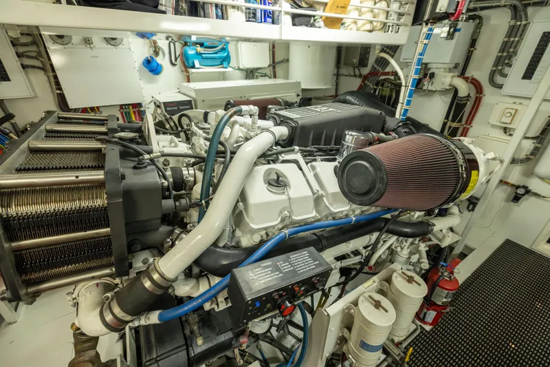 Outrageous Yacht Photos Pics Engine room of 2005 Hatteras 80 Motor Yacht, showcasing detailed machinery and components.