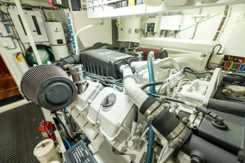 Outrageous Yacht Photos Pics Engine room of 2005 Hatteras 80 Motor Yacht, showcasing detailed machinery and components.