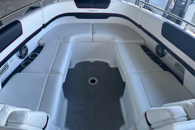 310 Bow Rider Yacht Photos Pics 2021 Formula 310 Bowrider I/O interior with white seating and cup holders.