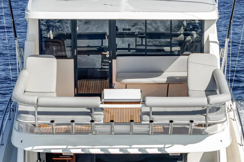 True North Yacht Photos Pics 2020 Maritimo M59 yacht with spacious deck seating and ocean view.