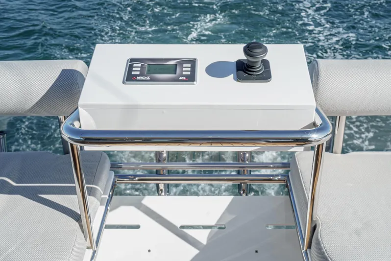 True North Yacht Photos Pics Control panel on 2020 Maritimo M59 yacht, featuring joystick and display, with ocean backdrop.