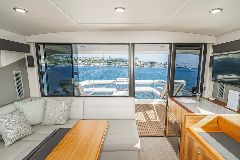 True North Yacht Photos Pics Luxurious interior of 2020 Maritimo M59 yacht with ocean view through large windows.