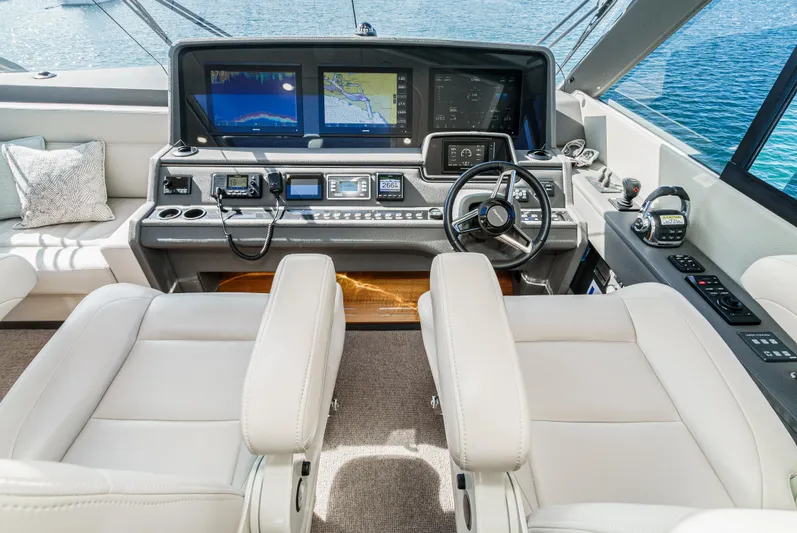 True North Yacht Photos Pics Helm of 2020 Maritimo M59 yacht with modern navigation equipment and luxurious seating.