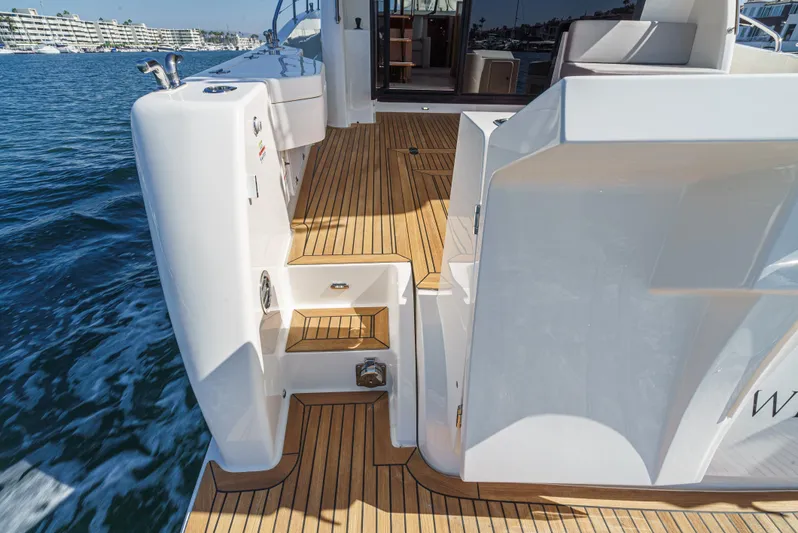 True North Yacht Photos Pics 2020 Maritimo M59 yacht deck with wooden flooring and water view.