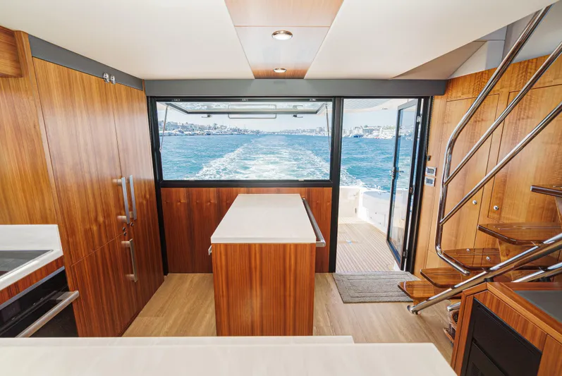 True North Yacht Photos Pics Interior of 2020 Maritimo M59 yacht with wooden finishes and ocean view.