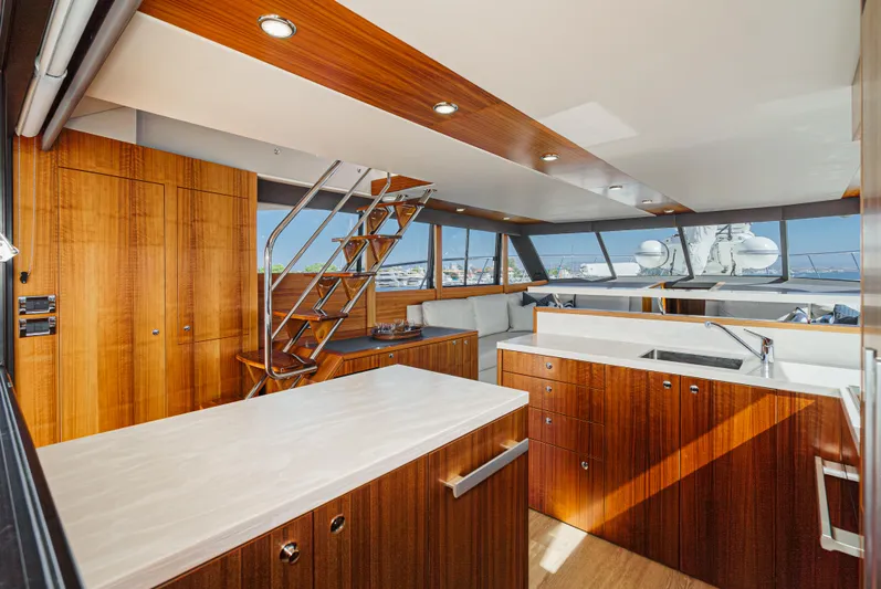 True North Yacht Photos Pics Luxurious interior of 2020 Maritimo M59 yacht with modern kitchen and seating area.
