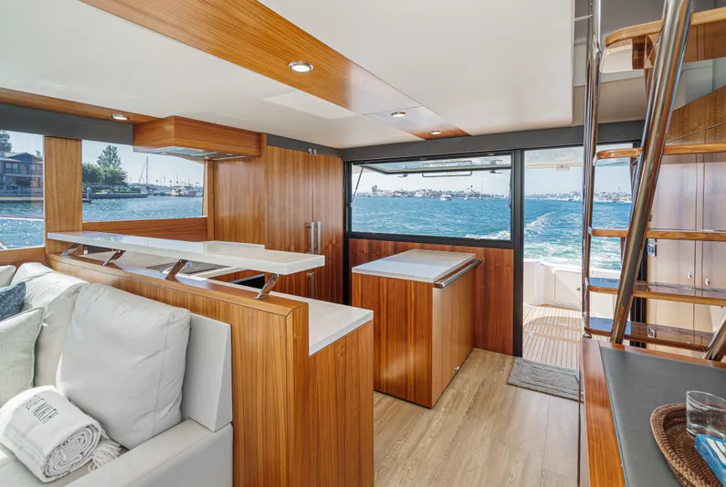 True North Yacht Photos Pics Luxurious interior of 2020 Maritimo M59 yacht with wooden finishes and ocean view.