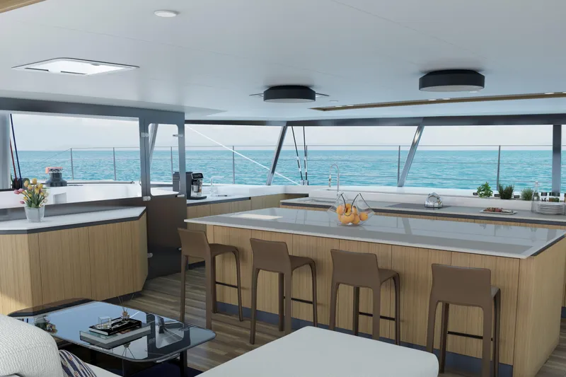  Yacht Photos Pics Luxurious interior of 2027 Balance 750 yacht with ocean view, modern kitchen, and seating area.