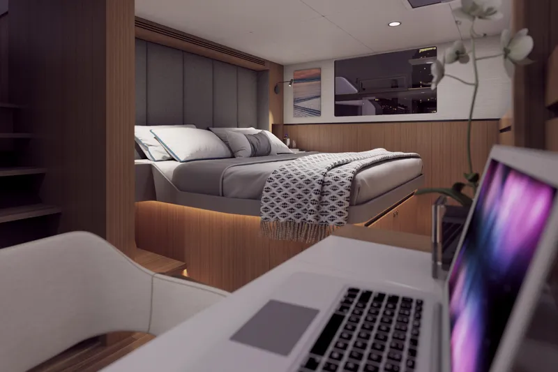  Yacht Photos Pics Luxurious cabin interior of Balance 750 yacht, featuring a cozy bed and modern workspace.