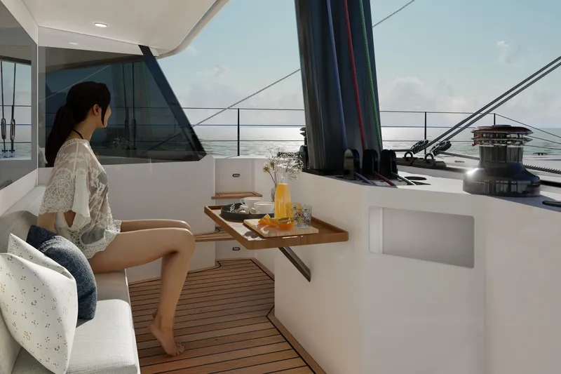  Yacht Photos Pics Woman relaxing on a Balance 750 yacht, enjoying a sunny day at sea.