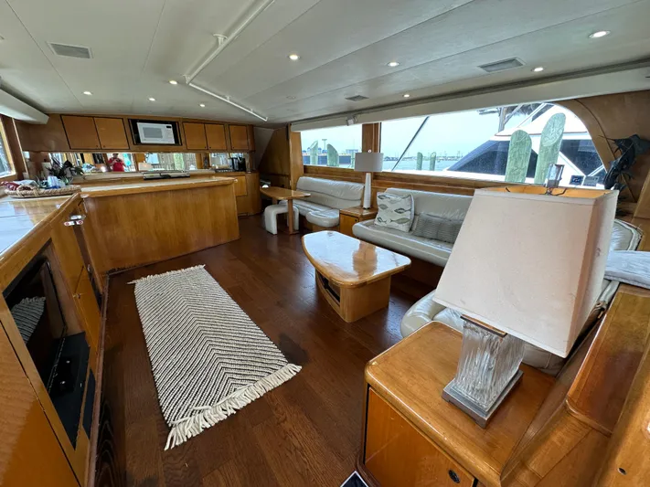 Poco Mas Yacht Photos Pics Interior of a 1996 Donzi Custom Enclosed Flybridge yacht with wooden furnishings.