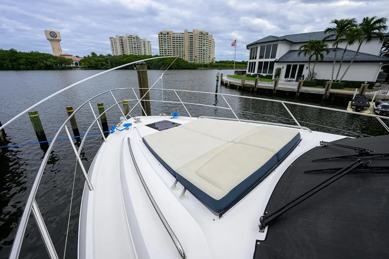 Yacht Photos Pics Princess F50 yacht docked near waterfront homes, 2022 model.