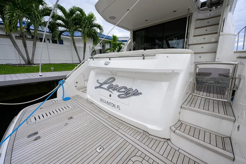  Yacht Photos Pics 2022 Princess F50 yacht docked, featuring elegant deck and stairs, Boca Raton, FL.