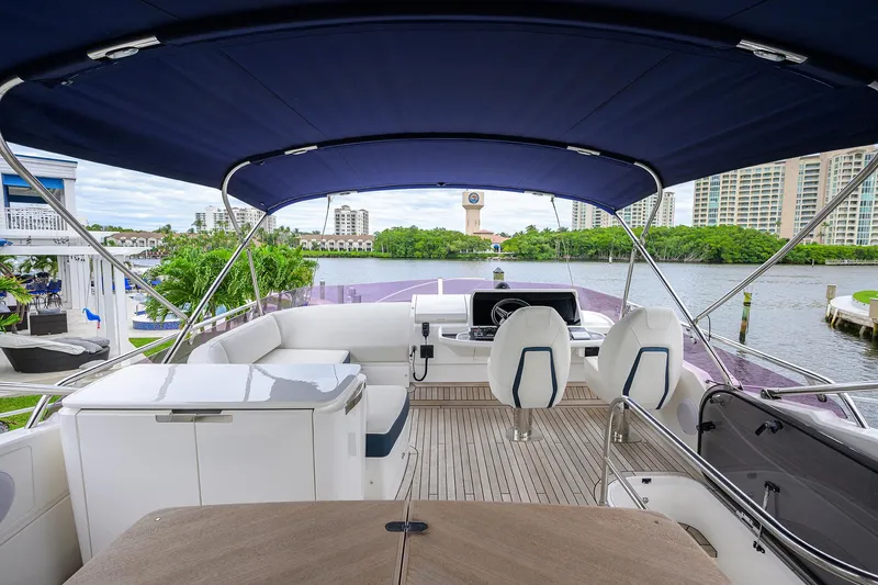  Yacht Photos Pics Luxurious 2022 Princess F50 yacht interior with modern seating and scenic waterfront view.