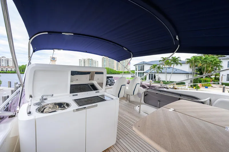  Yacht Photos Pics Luxury yacht Princess F50 2022 with outdoor kitchen and seating area.