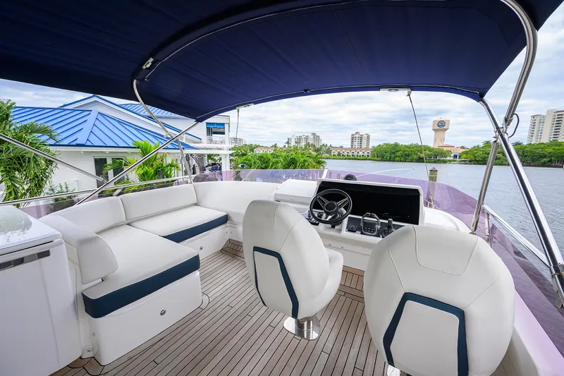  Yacht Photos Pics Luxurious 2022 Princess F50 yacht interior with modern seating and navigation controls.