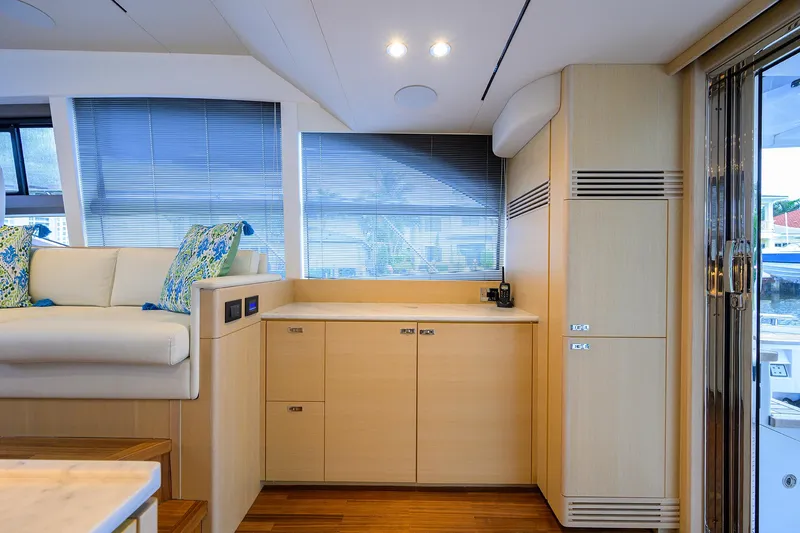  Yacht Photos Pics Interior of 2022 Princess F50 yacht with modern seating and cabinetry.