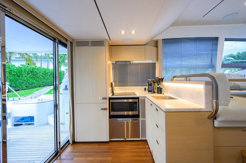  Yacht Photos Pics Modern kitchen interior on 2022 Princess F50 yacht, featuring sleek design and outdoor view.
