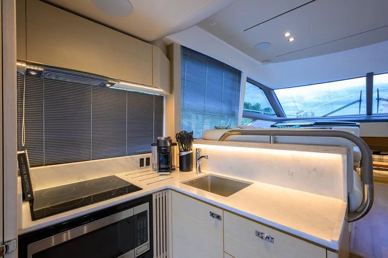  Yacht Photos Pics Modern kitchen interior on 2022 Princess F50 yacht, featuring sleek appliances and elegant design.