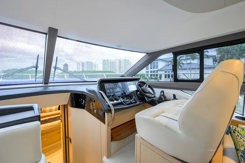  Yacht Photos Pics Luxurious 2022 Princess F50 yacht interior with modern helm and panoramic windows.