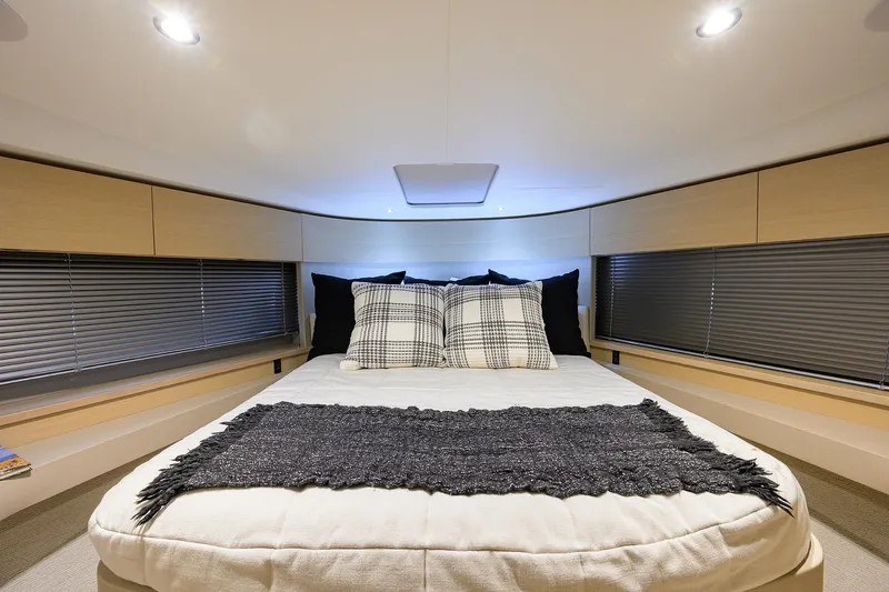  Yacht Photos Pics Luxurious bedroom interior of 2022 Princess F50 yacht with modern decor.
