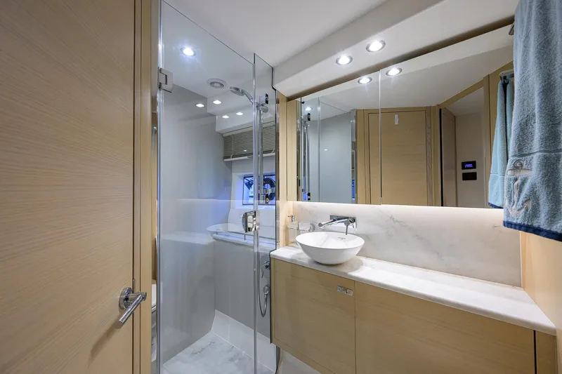  Yacht Photos Pics Luxurious bathroom in 2022 Princess F50 yacht with modern fixtures and elegant design.
