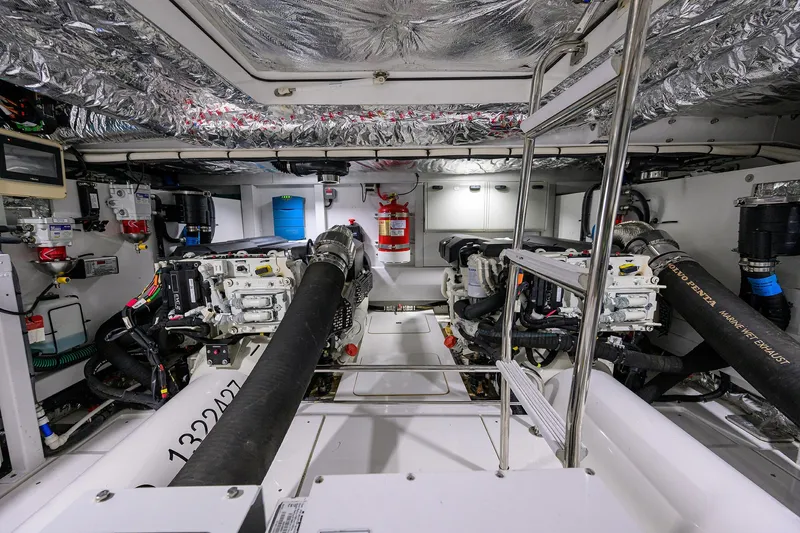  Yacht Photos Pics Engine room of 2022 Princess F50 yacht with dual engines and safety equipment.