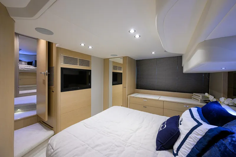  Yacht Photos Pics Luxurious 2022 Princess F50 yacht bedroom with modern decor and ambient lighting.