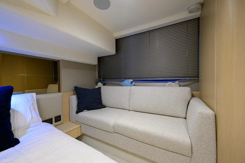  Yacht Photos Pics Luxurious interior of 2022 Princess F50 yacht with cozy seating and modern decor.