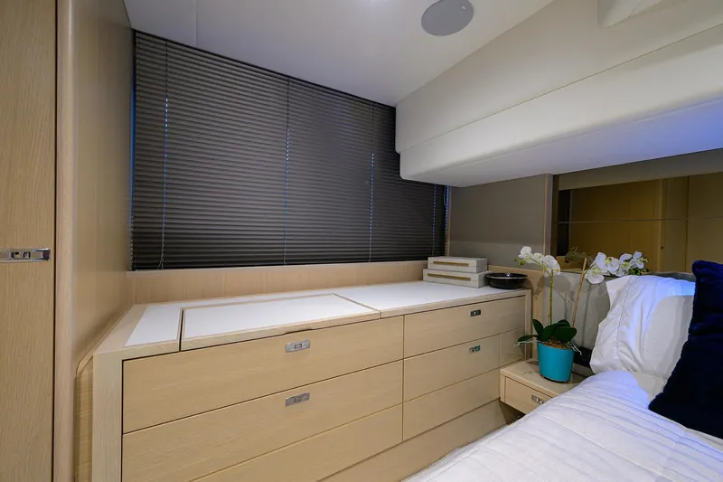  Yacht Photos Pics Luxurious interior of 2022 Princess F50 yacht with modern cabinetry and decor.