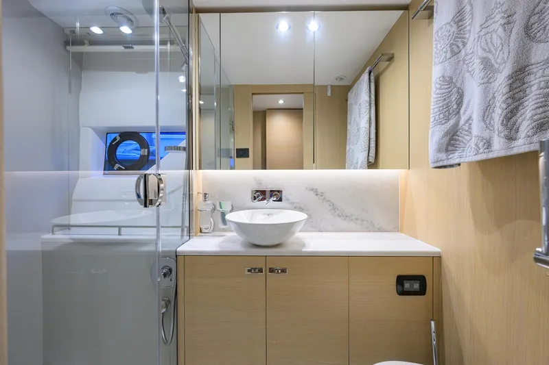  Yacht Photos Pics Modern bathroom interior on 2022 Princess F50 yacht, featuring sleek design and elegant fixtures.