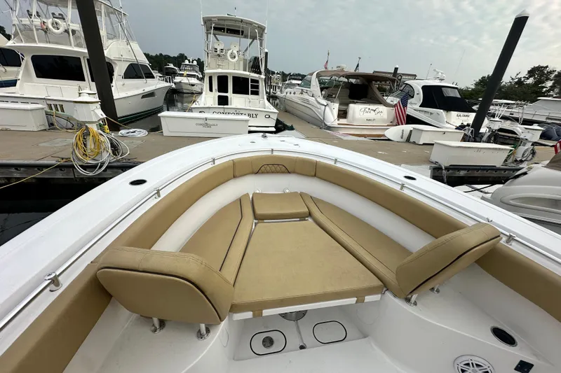  Yacht Photos Pics 2023 Sportsman Open 282 Center Console boat docked at marina with tan seating.