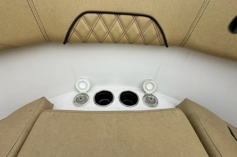  Yacht Photos Pics 2023 Sportsman Open 282 Center Console boat interior with cup holders and tan upholstery.
