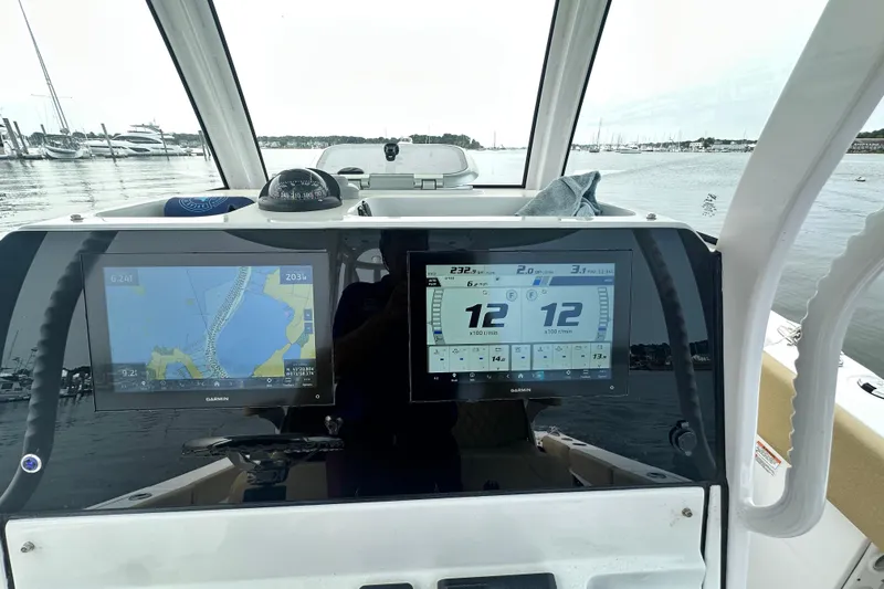  Yacht Photos Pics 2023 Sportsman Open 282 Center Console dashboard with dual Garmin displays on the water.
