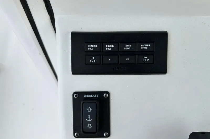  Yacht Photos Pics Control panel of 2023 Sportsman Open 282 Center Console with navigation and windlass buttons.