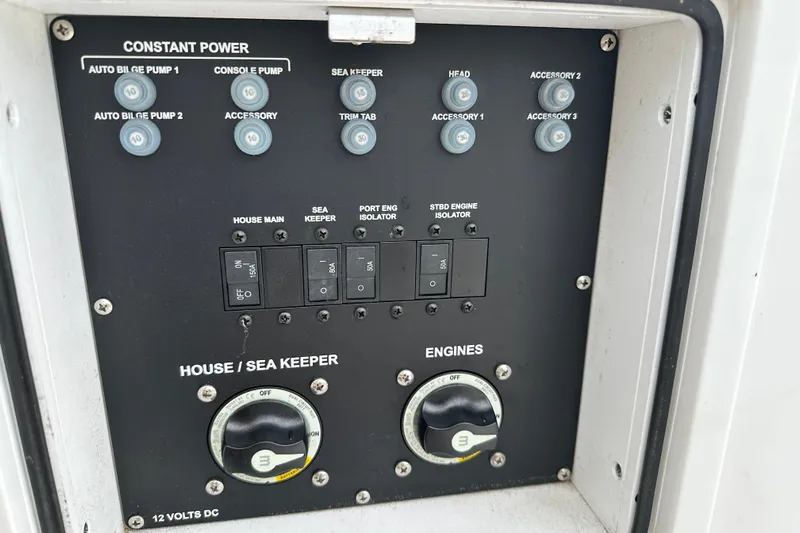  Yacht Photos Pics Control panel of 2023 Sportsman Open 282 Center Console boat, featuring switches and dials.
