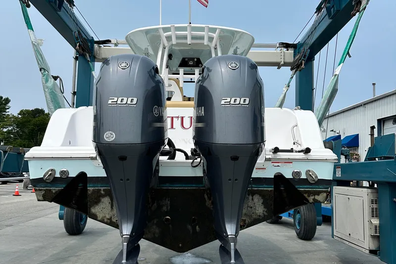  Yacht Photos Pics 2023 Sportsman Open 282 Center Console with dual Yamaha 200 engines in a boatyard.