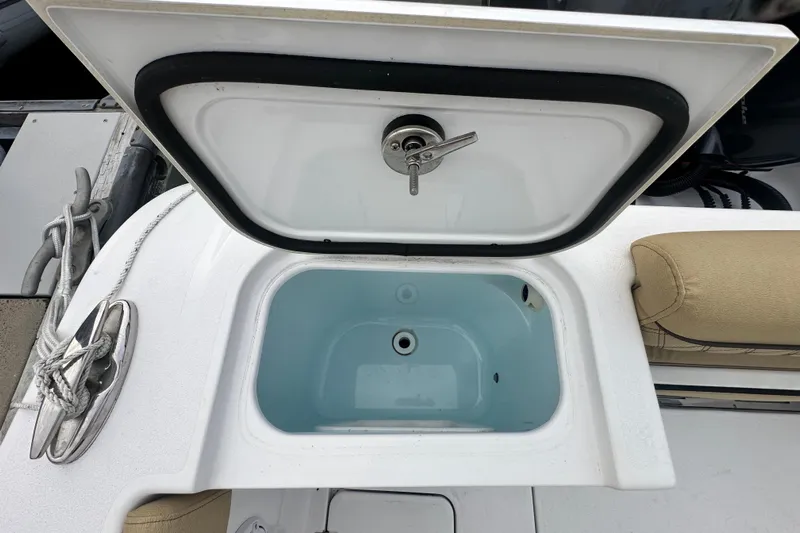  Yacht Photos Pics 2023 Sportsman Open 282 Center Console livewell with open lid, showcasing interior.