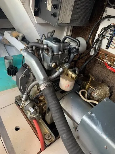 Duc De Kent Yacht Photos Pics Engine compartment of 1985 Custom Cape Island Trawler 43, showcasing mechanical components and wiring.