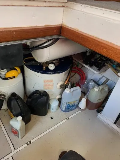 Duc De Kent Yacht Photos Pics Engine room of 1985 Custom Cape Island Trawler 43 with various maintenance supplies.