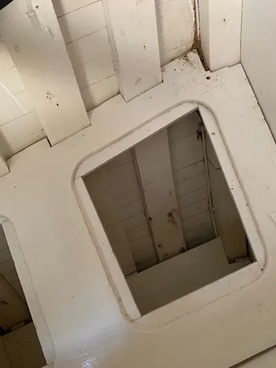 Duc De Kent Yacht Photos Pics Interior view of 1985 Custom Cape Island Trawler 43, showing a hatch opening.