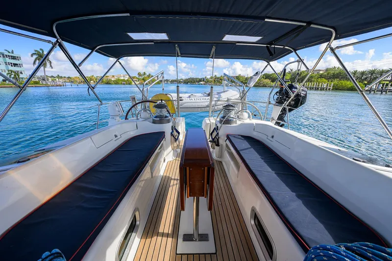 Windigo Yacht Photos Pics 2003 Beneteau 50 sailboat cockpit with seating, overlooking serene blue waters.