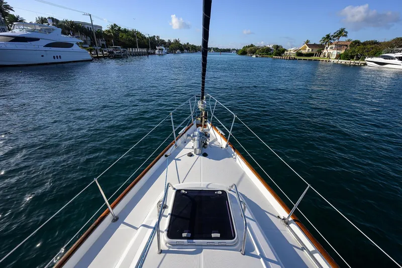 Windigo Yacht Photos Pics Bow view of 2003 Beneteau 50 yacht navigating a serene waterway.
