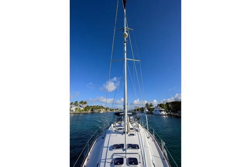 Windigo Yacht Photos Pics Sailing yacht Beneteau 50, 2003 model, docked in a sunny marina.