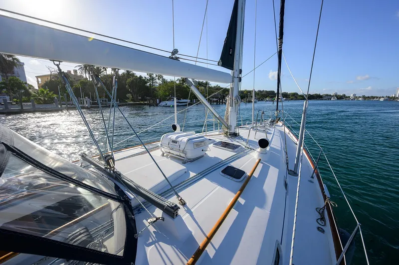 Windigo Yacht Photos Pics Sailing yacht Beneteau 50, 2003 model, cruising on a sunny day near the coastline.