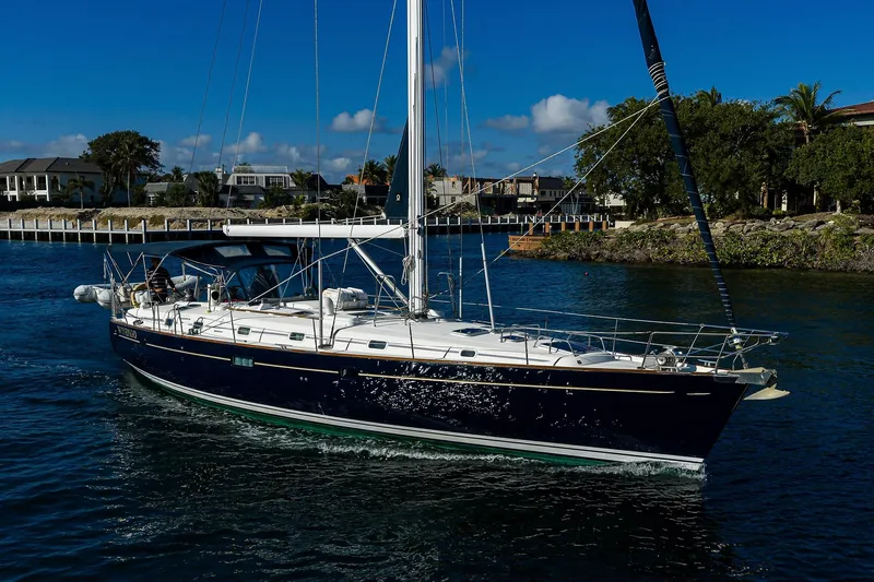 Windigo Yacht Photos Pics 2003 Beneteau 50 sailboat cruising on a sunny day near a coastal area.