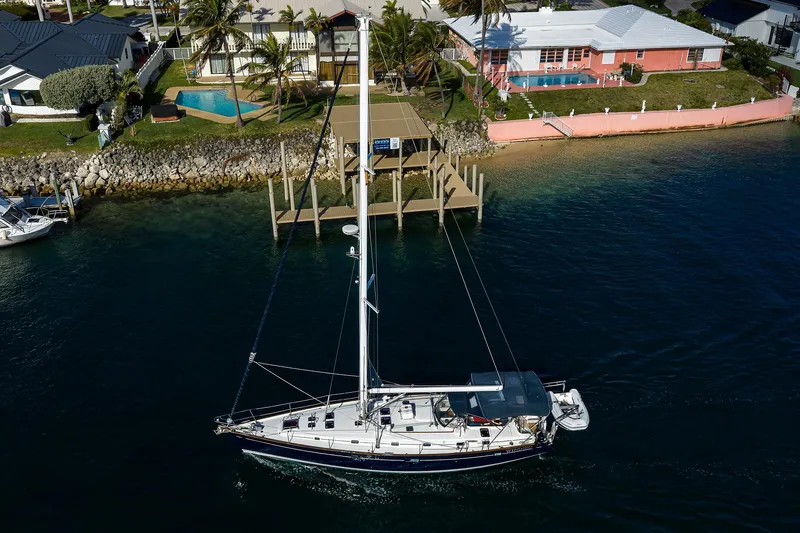 Windigo Yacht Photos Pics Aerial view of 2003 Beneteau 50 sailboat near waterfront homes.