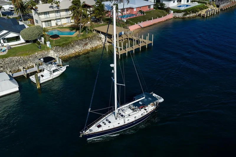 Windigo Yacht Photos Pics Aerial view of 2003 Beneteau 50 sailboat near waterfront homes and docks.