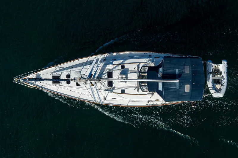 Windigo Yacht Photos Pics Aerial view of 2003 Beneteau 50 yacht sailing on dark water.